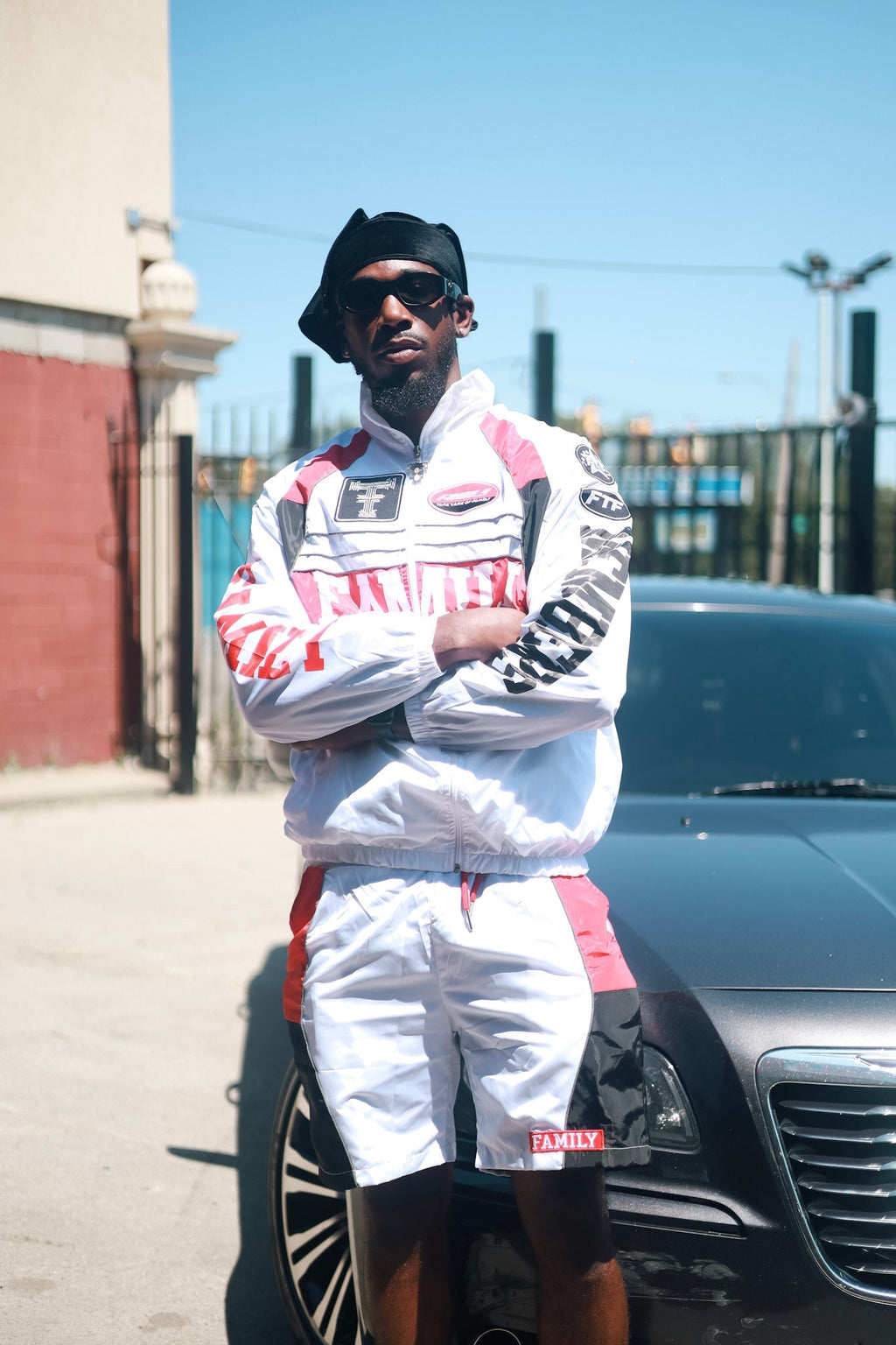 Family Takes Care of Family White Black Red windbreaker set front view