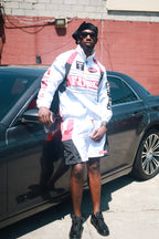Family Takes Care of Family White Black Red windbreaker set standing by car